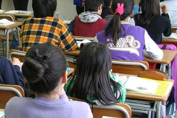 Elementary school students sitting in a classroom